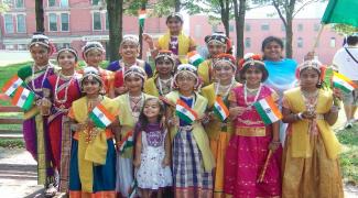 India children group photo with mini flags of India
