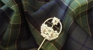 tartan with gold kilt pin